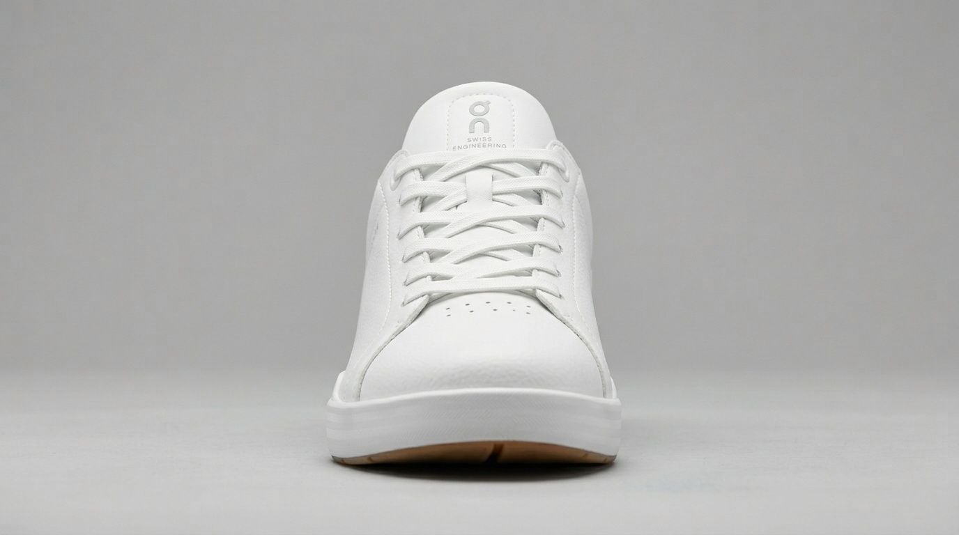Front view of an On The Roger Clubhouse white sneaker against a plain neutral background.